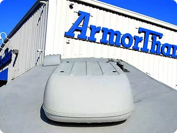 Industrial-grade white ArmorThane polyurea protective roof coating applied to an RV in Abilene.