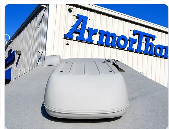 Industrial ArmorThane polyurea protective spray applied across a residential RV roof.